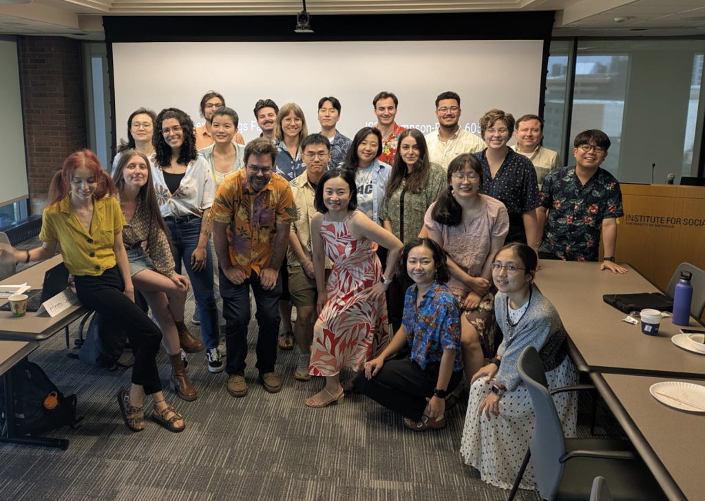 EITM's group photo with Chris Fariss. Many participants are in Hawaiian shirts in Chris's honor.