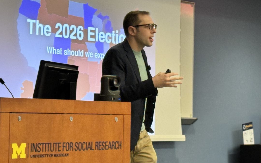 Josh Pasek at the ISR dais. The slide behind him has an election map for the 2026 Elections